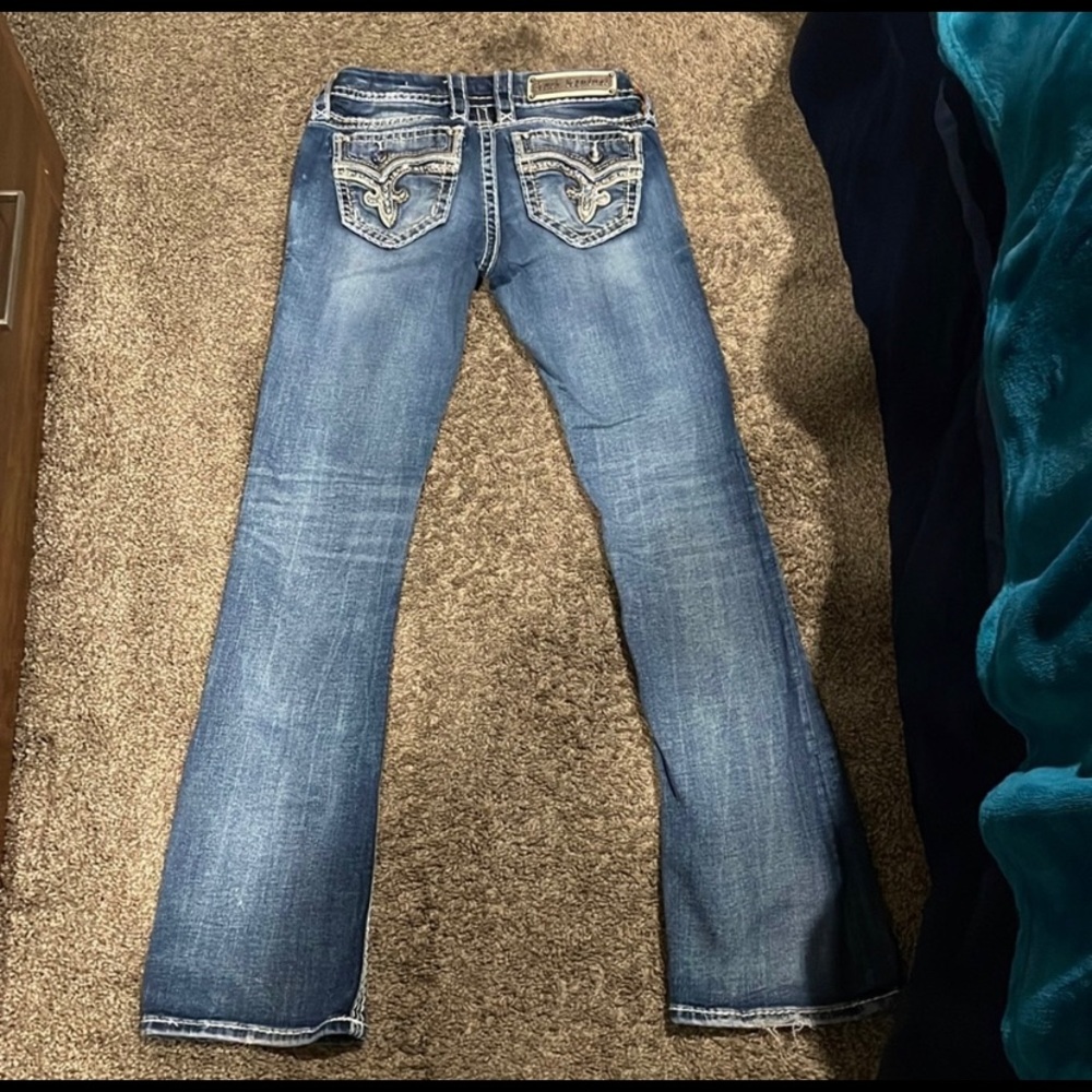 Selling these Rock Revival bootcut jeans, mid rise size 25 inseam 30”